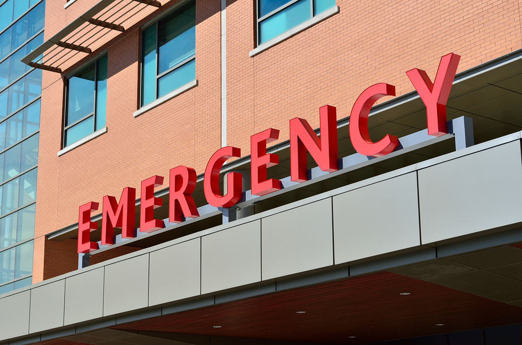 Emergency room sign on a hospital that likely isn't covered by discount plans of health insurance.