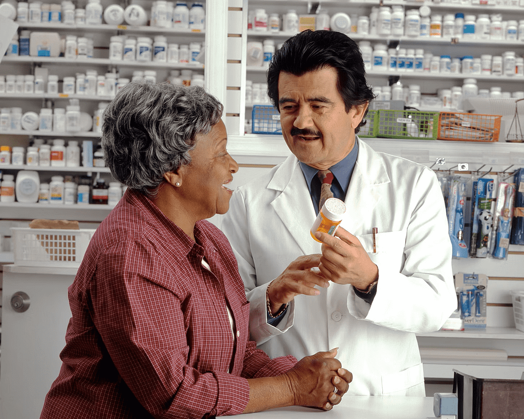 A doctor helping a patient set up a Medicare Prescription Payment Plan