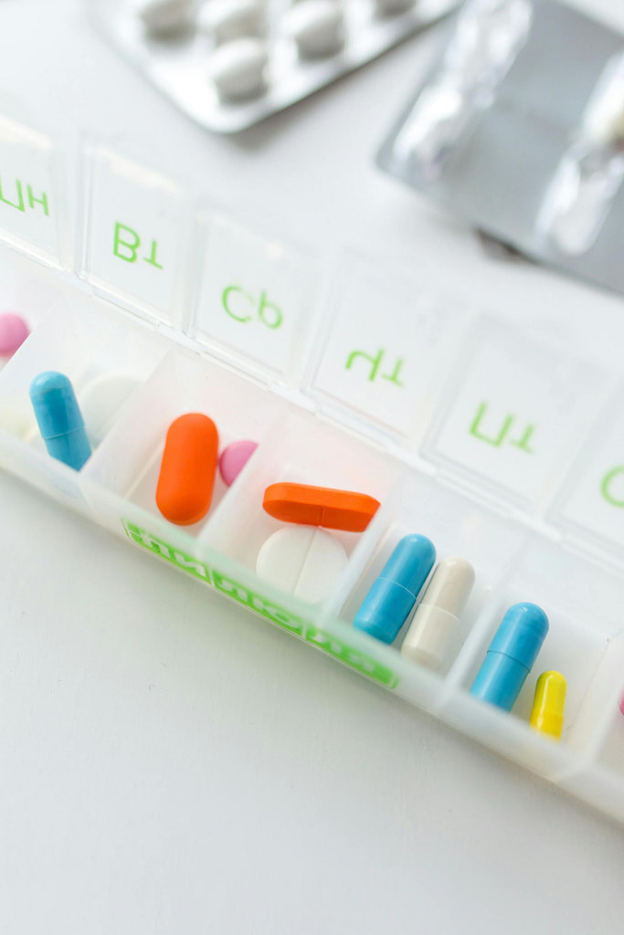 Box of prescription medication organized by the day of the week, all covered by Health Reimbursement Arrangements in Reno